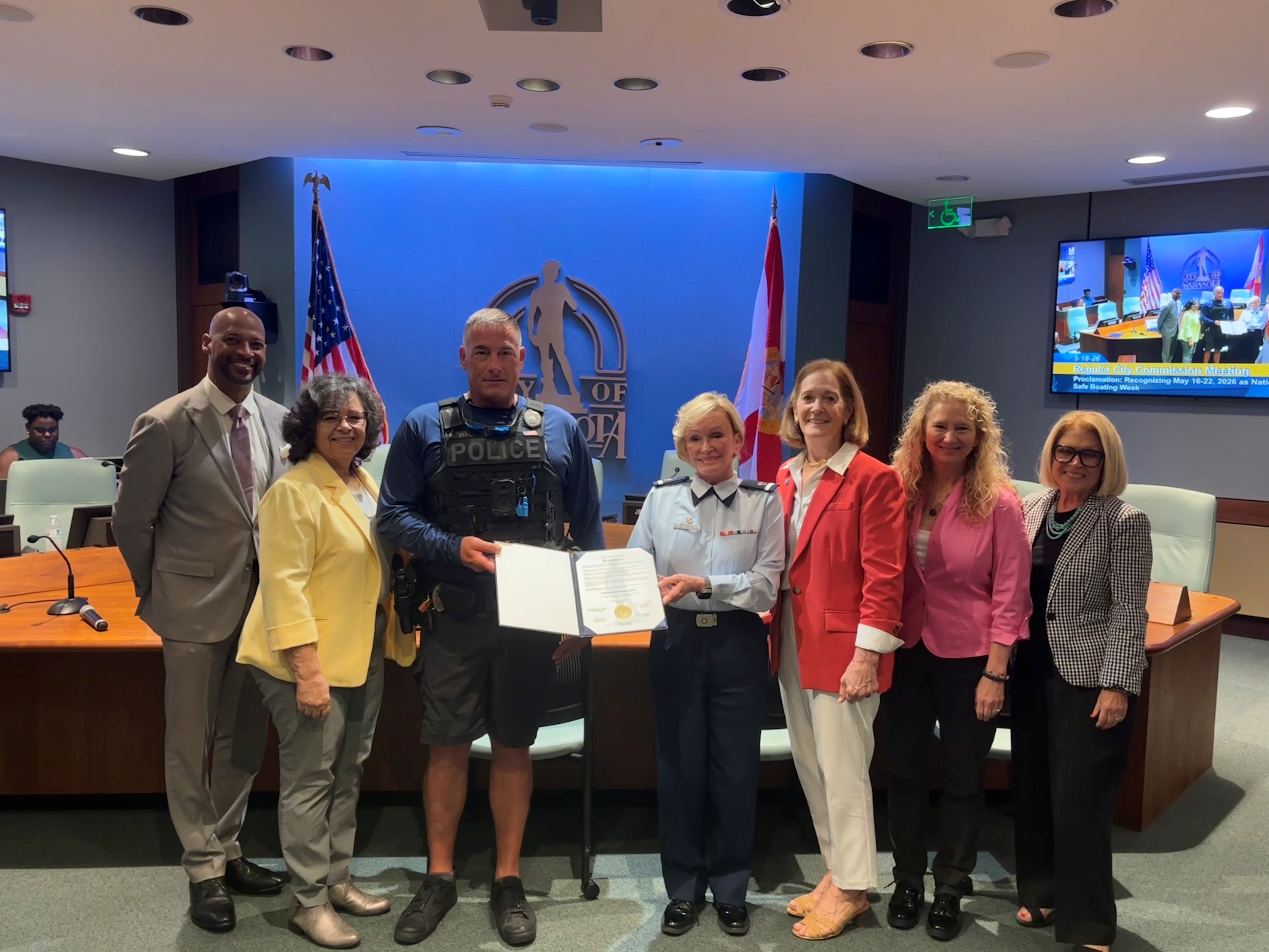 Group photo of the City Commission and representatives from the Sarasota Police Marine Unit and the U.S. Coast Guard Auxiliary from Flotilla 84