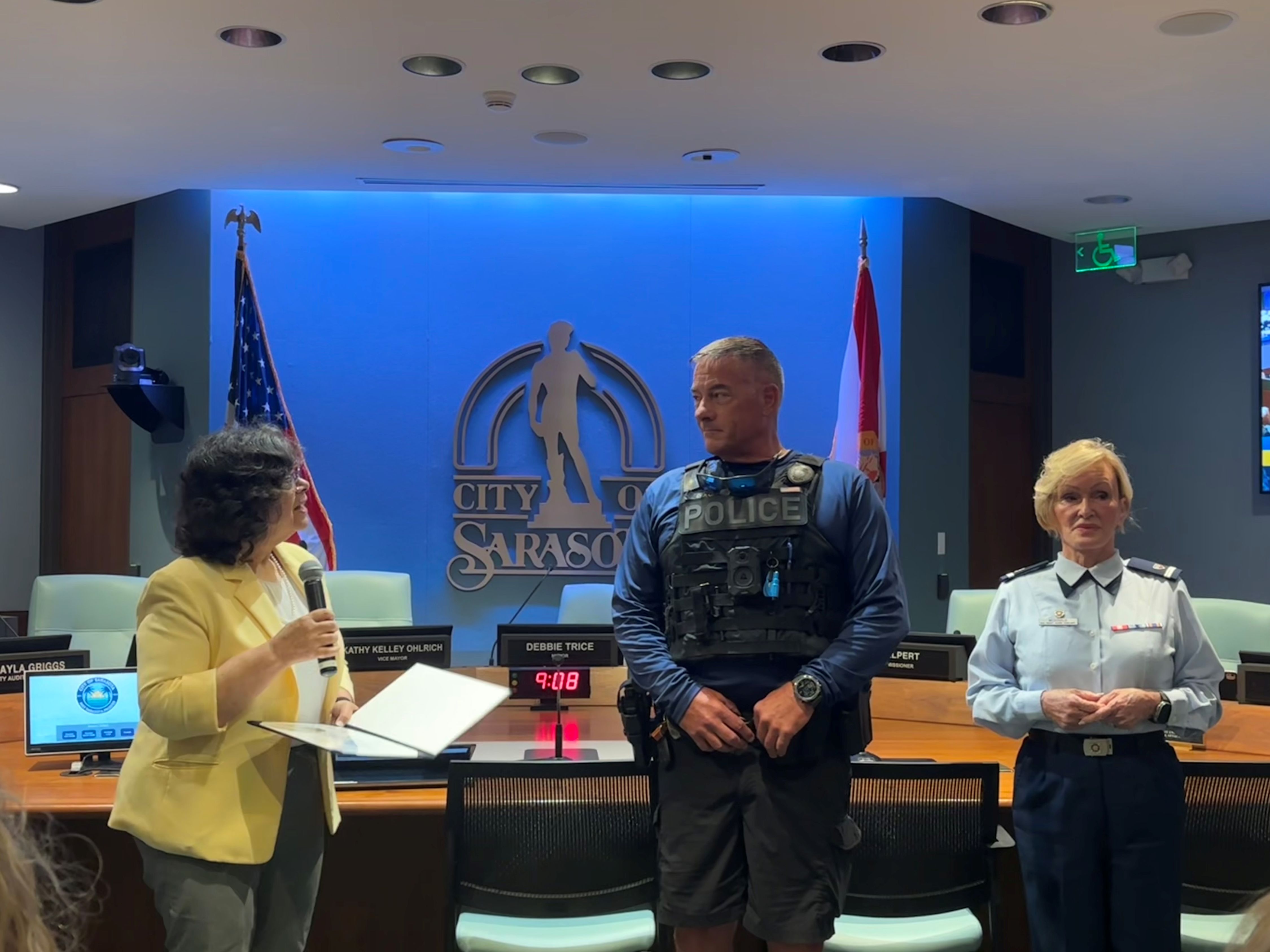 Group photo of the City Commission and representatives from the Sarasota Police Marine Unit and the U.S. Coast Guard Auxiliary from Flotilla 84